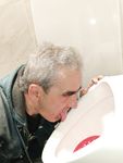 The loser faggot Oleg Yakubovsky licking urinals.