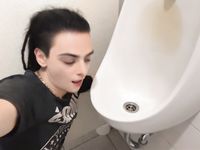 Femboy licks urinal at sports arena