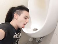 Femboy licks urinal at sports arena