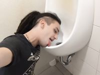 Femboy licks urinal at sports arena