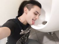 Femboy licks urinal at sports arena