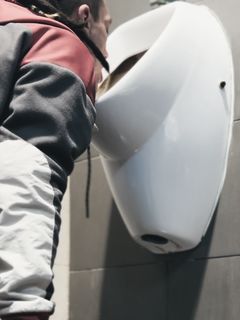 Nasty sissy licks public urinal