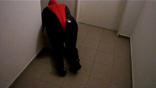 Petplay in latex suit