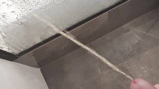 Hairy uncut cock pees in shower