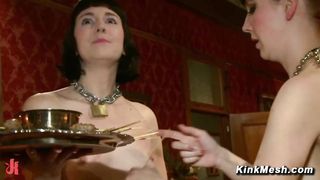 Submissive service slaves at BDSM party