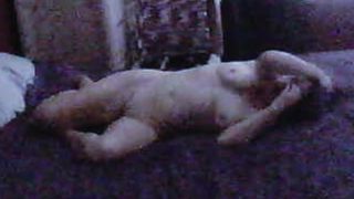 Mature naked on the bed